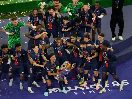 PSG players celebrate with the trophy after winning the Champions League final soccer match between Paris Saint-Germain and Inter Milan at the Allianz Arena in Munich, Germany, Saturday, May 31, 2025. (AP Photo/Michael Probst)

- XCHAMPIONSLEAGUEX