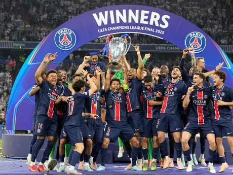 PSG's Marquinhos holds up the trophy as he celebrates with his teammates after winning the Champions League final soccer match between Paris Saint-Germain and Inter Milan at the Allianz Arena in Munich, Germany, Saturday, May 31, 2025. (AP Photo/Martin Meissner)

- XCHAMPIONSLEAGUEX
