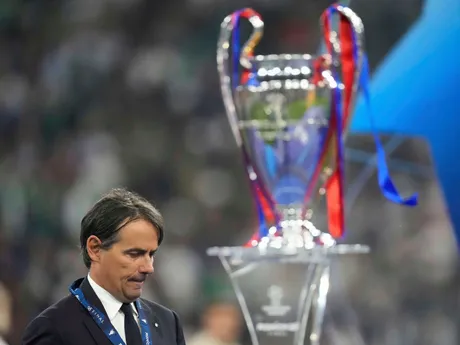 Inter Milan's head coach Simone Inzaghi walks by the trophy after the Champions League final soccer match between Paris Saint-Germain and Inter Milan at the Allianz Arena in Munich, Germany, Saturday, May 31, 2025. (AP Photo/Matthias Schrader)

- XCHAMPIONSLEAGUEX