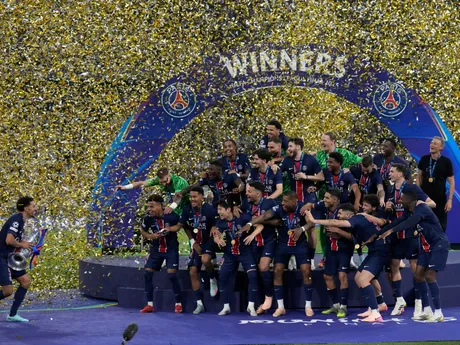 PSG players celebrate with the trophy after winning the Champions League final soccer match between Paris Saint-Germain and Inter Milan at the Allianz Arena in Munich, Germany, Saturday, May 31, 2025. (AP Photo/Matthias Schrader)

- XCHAMPIONSLEAGUEX