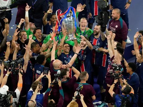 PSG's Achraf Hakimi celebrates with the trophy after winning the Champions League final soccer match between Paris Saint-Germain and Inter Milan at the Allianz Arena in Munich, Germany, Saturday, May 31, 2025. (AP Photo/Michael Probst)

- XCHAMPIONSLEAGUEX