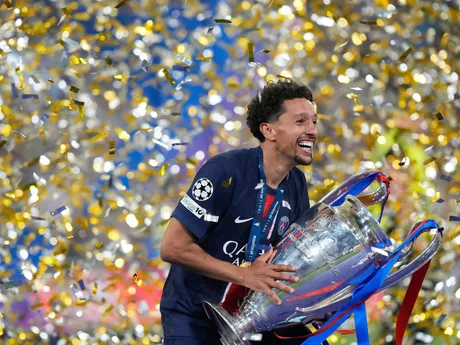 PSG's team captain Marquinhos holds the trophy after winning the Champions League final soccer match between Paris Saint-Germain and Inter Milan at the Allianz Arena in Munich, Germany, Saturday, May 31, 2025. (AP Photo/Luca Bruno)

- XCHAMPIONSLEAGUEX
