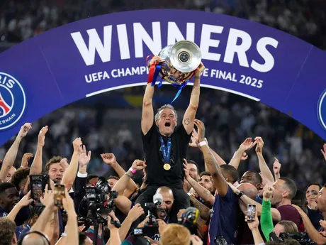 PSG's head coach Luis Enrique celebrates with the trophy after winning the Champions League final soccer match between Paris Saint-Germain and Inter Milan at the Allianz Arena in Munich, Germany, Saturday, May 31, 2025. (AP Photo/Matthias Schrader)

- XCHAMPIONSLEAGUEX