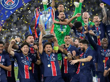 PSG players celebrate with the trophy after winning the Champions League final soccer match between Paris Saint-Germain and Inter Milan at the Allianz Arena in Munich, Germany, Saturday, May 31, 2025. (AP Photo/Matthias Schrader)

- XCHAMPIONSLEAGUEX