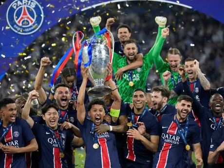 PSG players celebrate with the trophy after winning the Champions League final soccer match between Paris Saint-Germain and Inter Milan at the Allianz Arena in Munich, Germany, Saturday, May 31, 2025. (AP Photo/Matthias Schrader)

- XCHAMPIONSLEAGUEX
