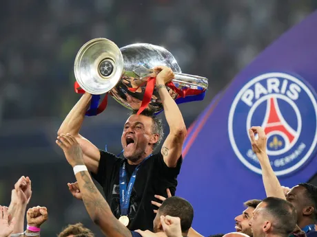 PSG's head coach Luis Enrique holds the trophy after winning the Champions League final soccer match between Paris Saint-Germain and Inter Milan at the Allianz Arena in Munich, Germany, Saturday, May 31, 2025. (AP Photo/Luca Bruno)

- XCHAMPIONSLEAGUEX