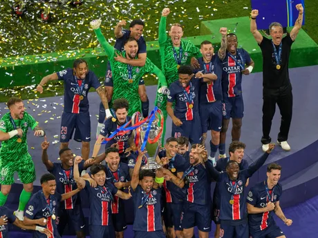 PSG's Marquinhos celebrates with the trophy after winning the Champions League final soccer match between Paris Saint-Germain and Inter Milan at the Allianz Arena in Munich, Germany, Saturday, May 31, 2025. (AP Photo/Michael Probst)

- XCHAMPIONSLEAGUEX