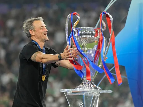 PSG's head coach Luis Enrique touches the trophy after winning the Champions League final soccer match against Inter Milan at the Allianz Arena in Munich, Germany, Saturday, May 31, 2025. (AP Photo/Martin Meissner)

- XCHAMPIONSLEAGUEX