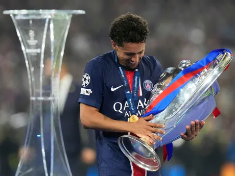 PSG's team captain Marquinhos carries the trophy after winning the Champions League final soccer match between Paris Saint-Germain and Inter Milan at the Allianz Arena in Munich, Germany, Saturday, May 31, 2025. (AP Photo/Luca Bruno)

- XCHAMPIONSLEAGUEX