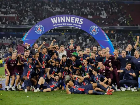 PSG players celebrate with the trophy after winning the Champions League final soccer match between Paris Saint-Germain and Inter Milan at the Allianz Arena in Munich, Germany, Saturday, May 31, 2025. (AP Photo/Matthias Schrader)

- XCHAMPIONSLEAGUEX